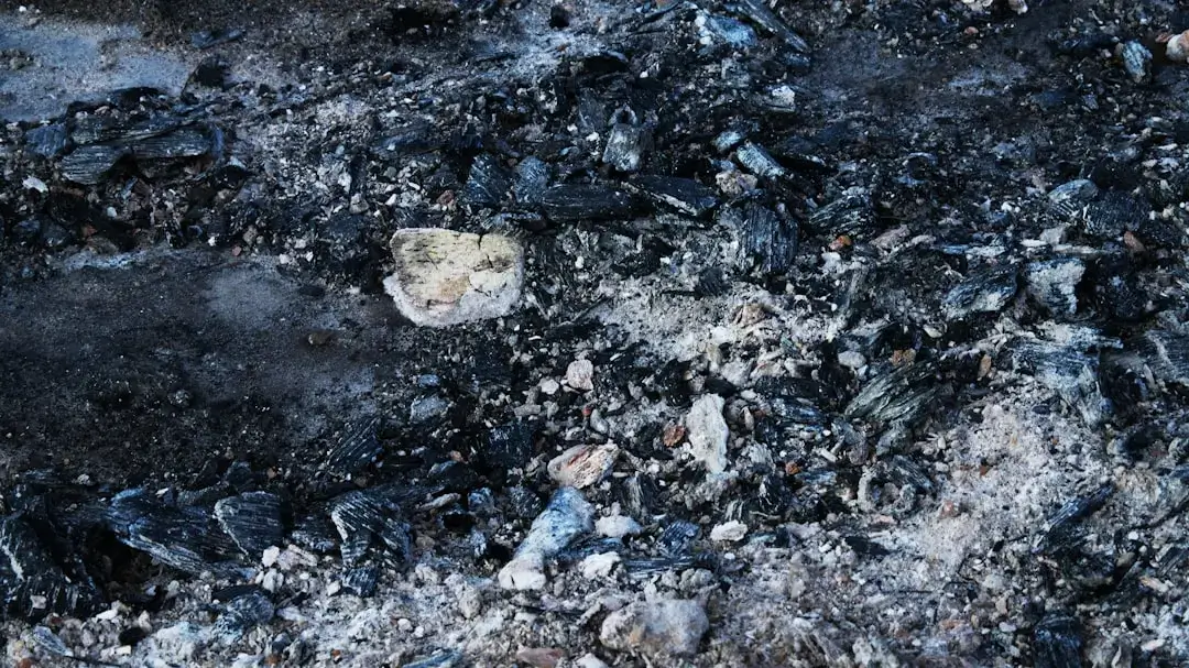 A close up of a fire hydrant covered in coal