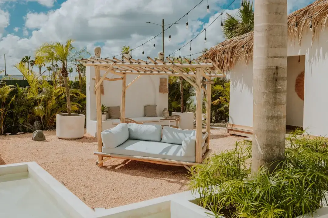 A cozy outdoor lounge area under a pergola