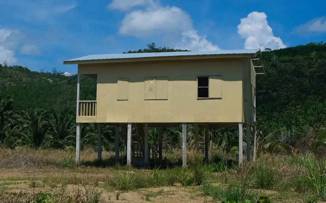 a yellow building with a balcony on top of it