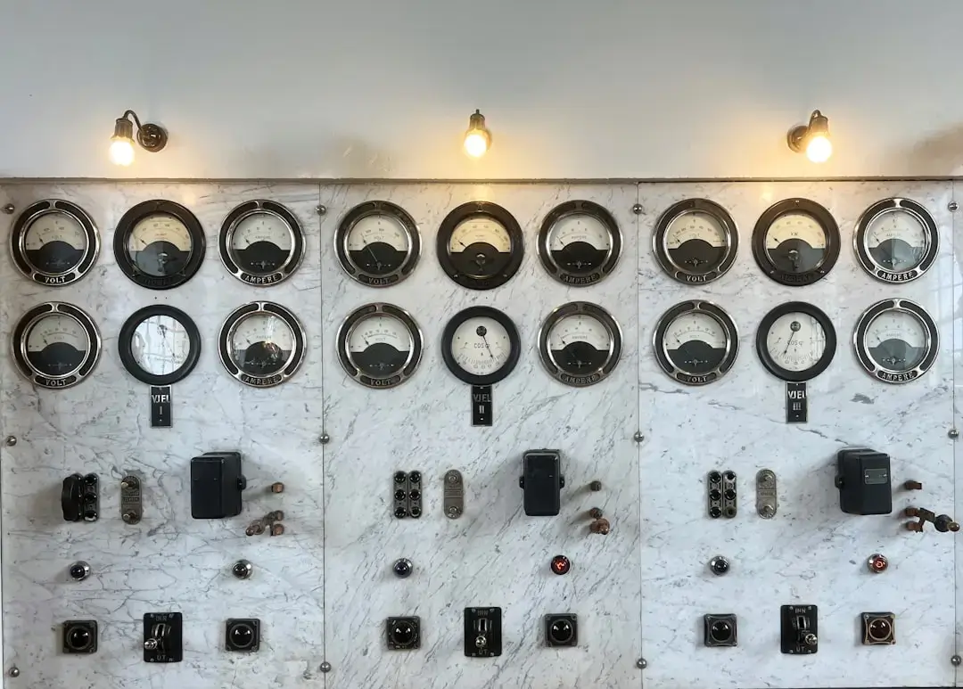 a wall with many buttons and switches