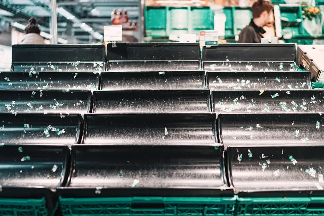 A collection of aluminum soda cans being organized and sorted for sustainable metal recycling.