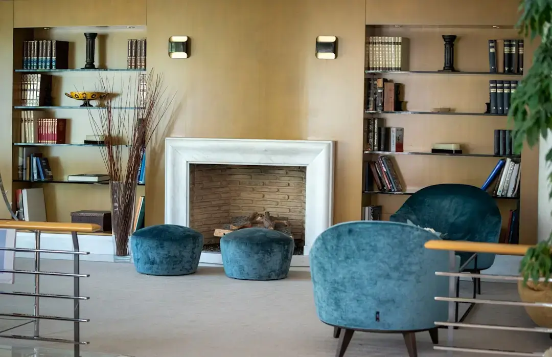 A warm and inviting living room with a glowing fireplace and comfortable seating.