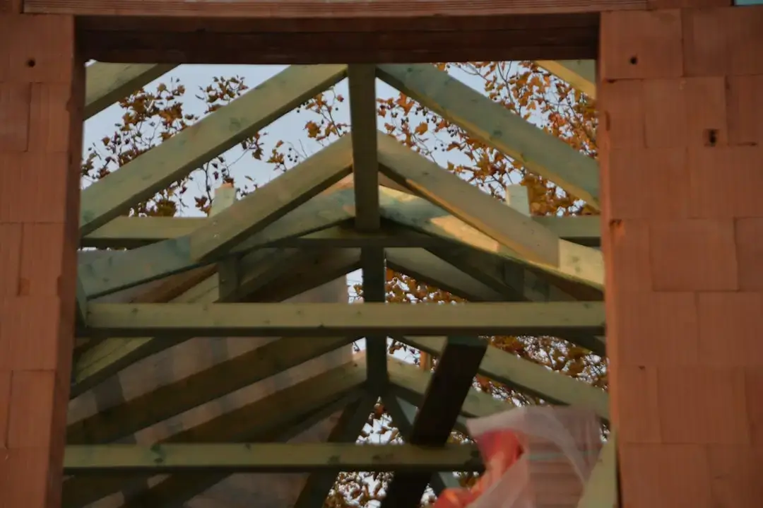 Close-up of stacked cross-laminated timber panels showing the layered wood grain and sustainable construction material.