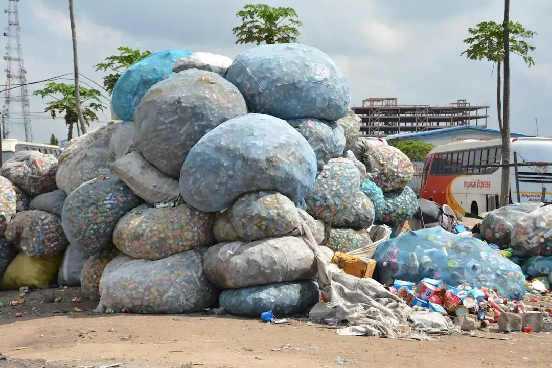 A closeup of crushed and discarded plastic bottles highlighting the issue of plastic waste and the importance of recycling.