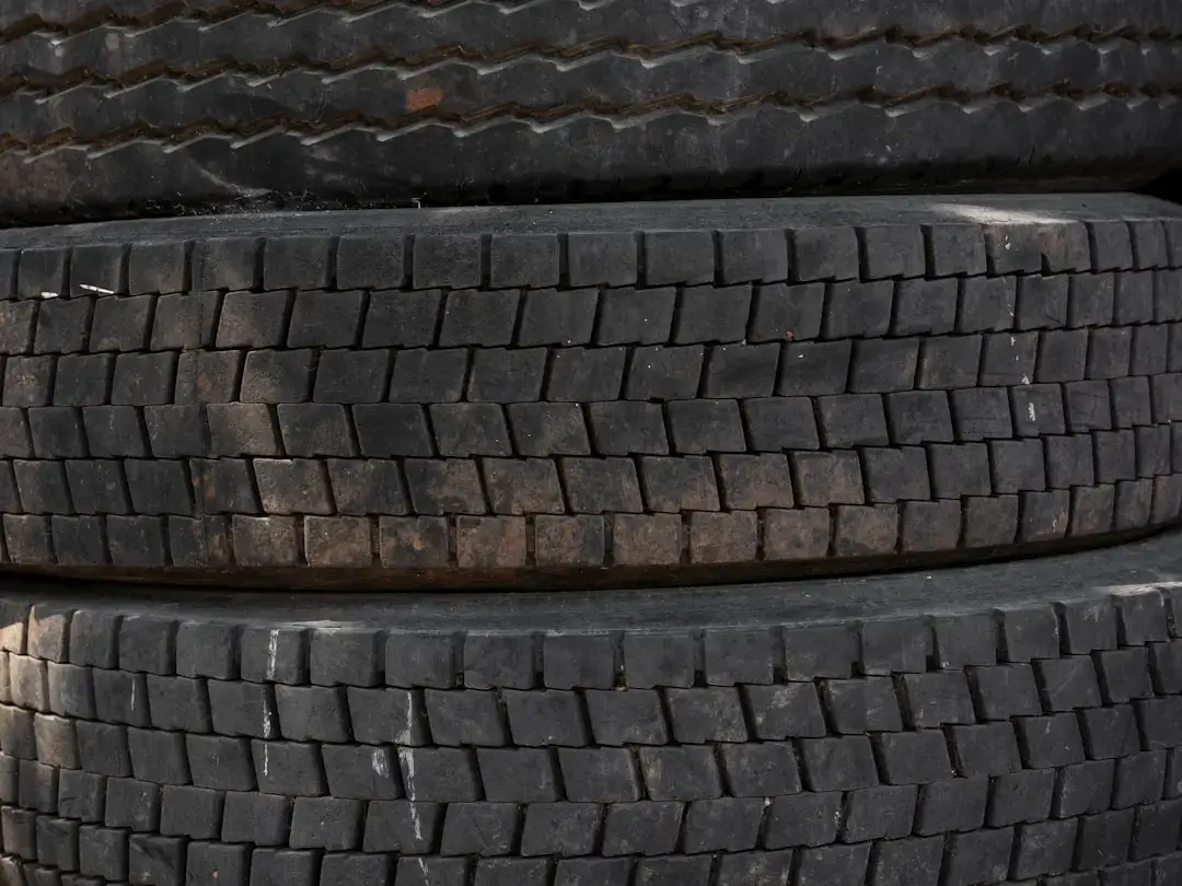 Stack of used black rubber tires