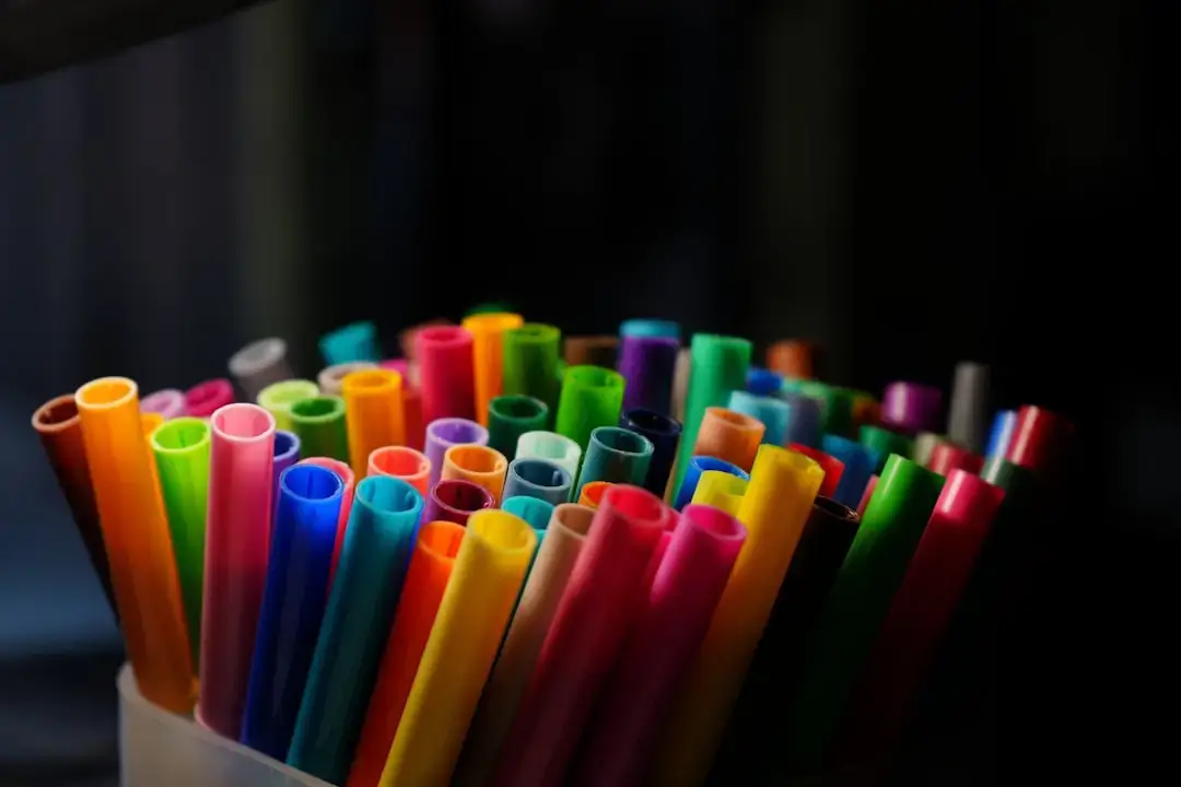 A close-up shot of a classic colorful disposable plastic pocket lighter on a neutral background.