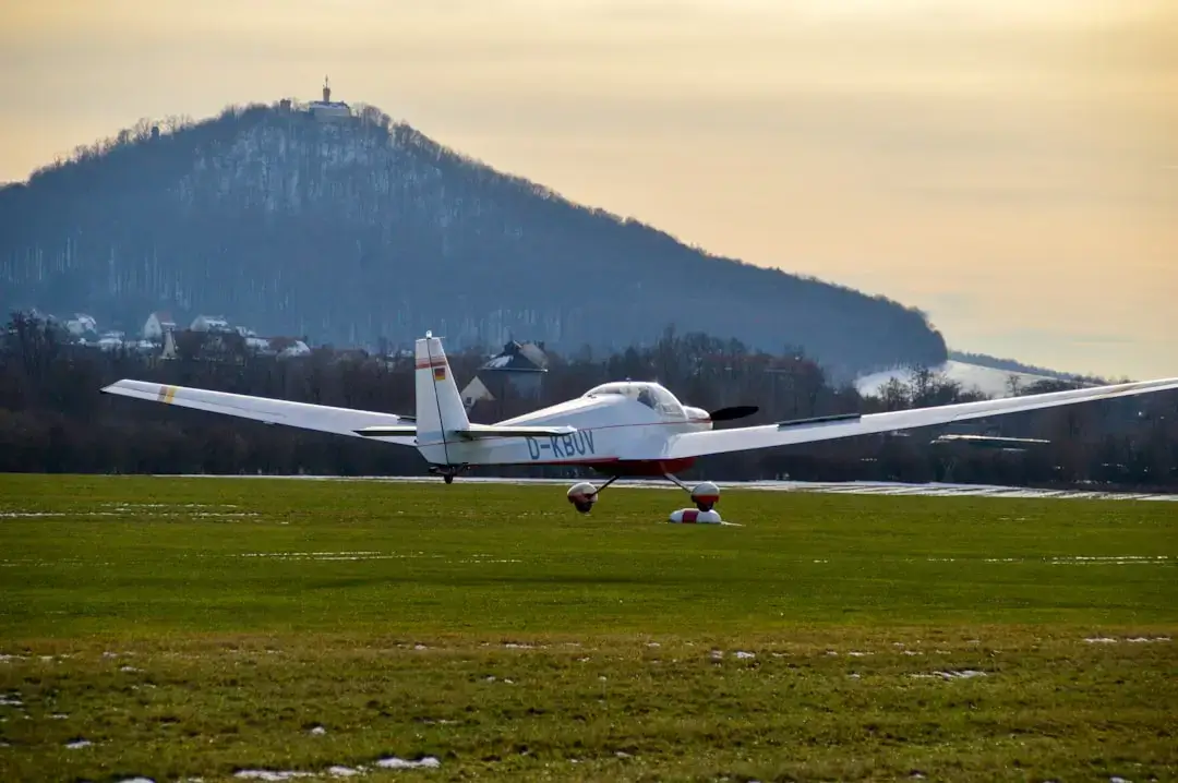 A sleek modern electric airplane prototype on a runway representing eco-friendly aviation technology.