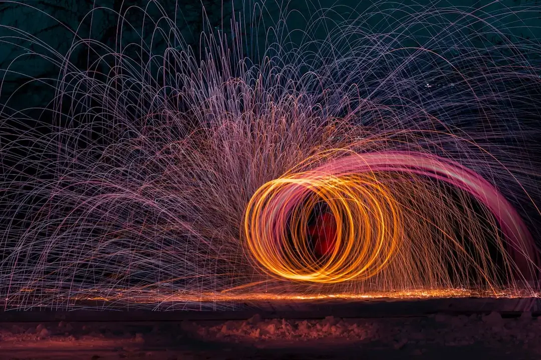 An industrial melting furnace glowing with molten metal in a steel manufacturing plant