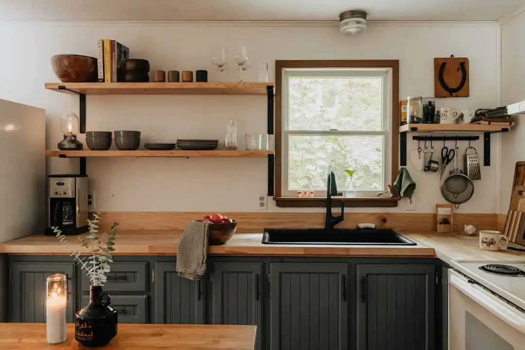 A bright modern kitchen featuring energy-efficient stainless steel appliances and sustainable design elements.