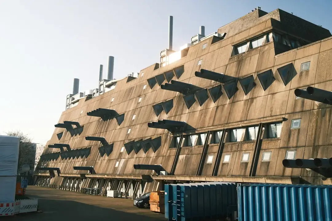An organized waste recycling center with sorted plastics, paper, and glass containers prepared for eco-friendly processing.