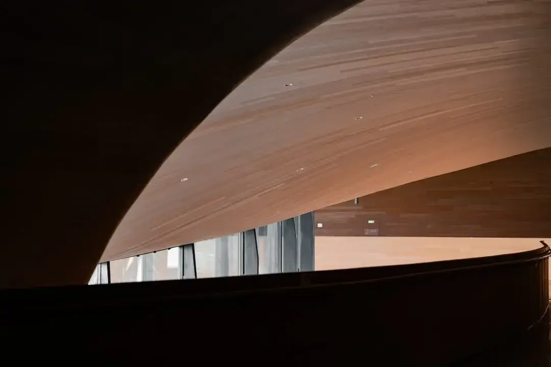 Close-up of modern sustainable wooden architecture featuring intricate timber beams and contemporary structural design.