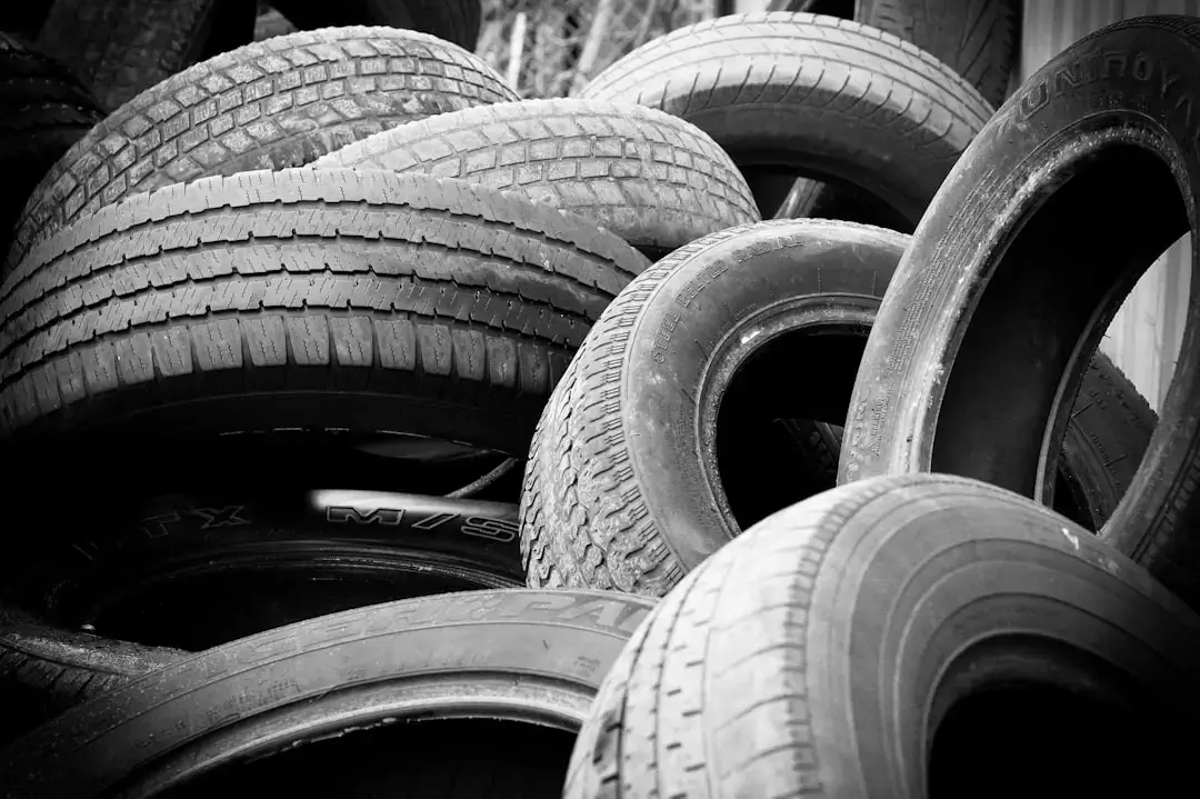 Close-up of stacked old bicycle tires prepared for sustainable recycling processes.
