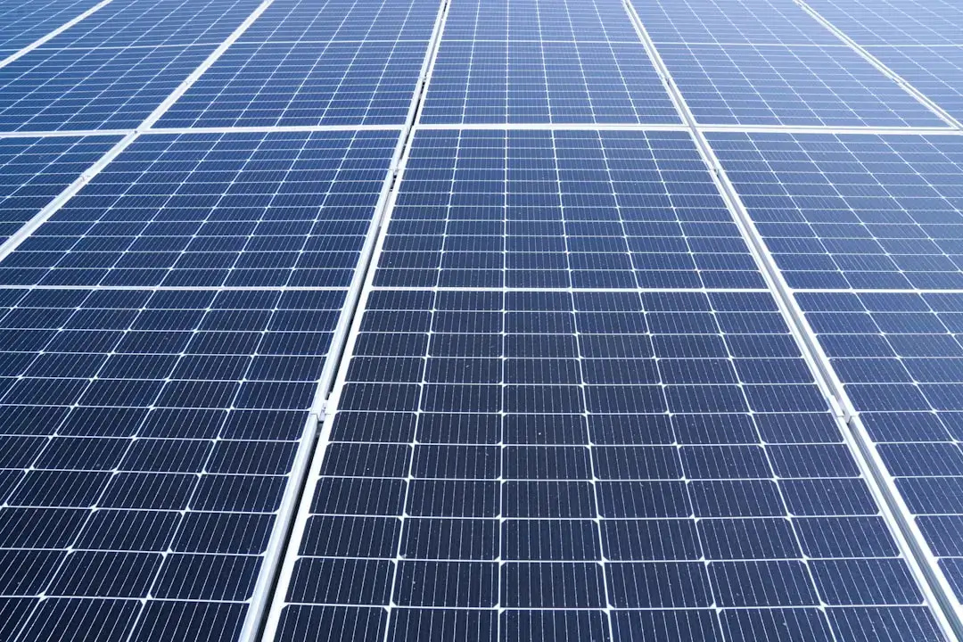Modern solar panels on a rooftop under a bright sun representing financial savings and renewable energy.