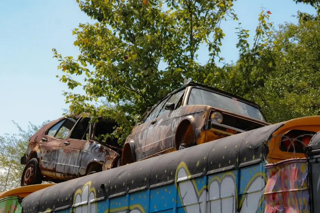 A systematic arrangement of sorted automotive waste parts and metal scrap at a recycling facility.