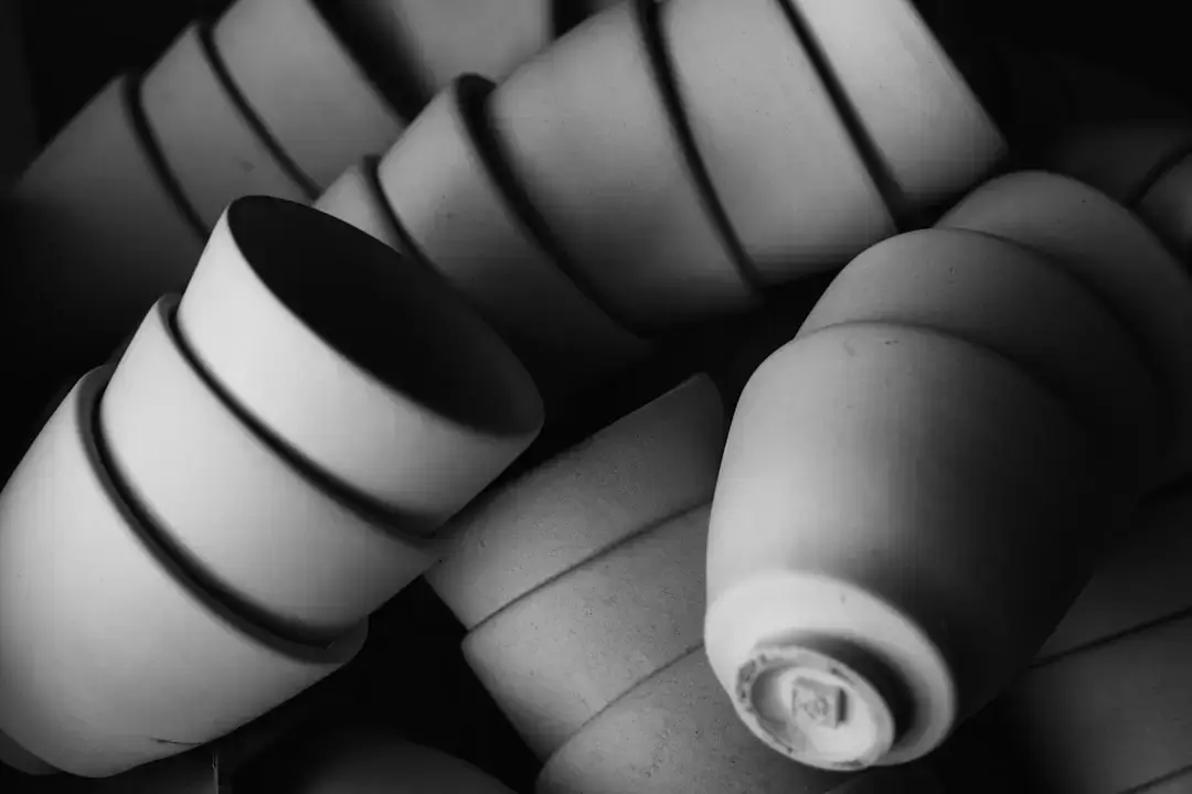 Stack of terracotta pots in black and white
