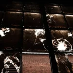 a brick wall with a brick walkway