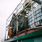 white IBC tanks on green building