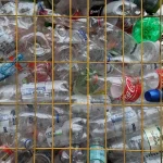 a bunch of bottles that are in a cage