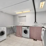 A laundry room with a washer and dryer