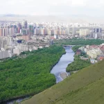 An aerial view of a city and a river