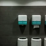 white toilet paper roll on white toilet paper holder