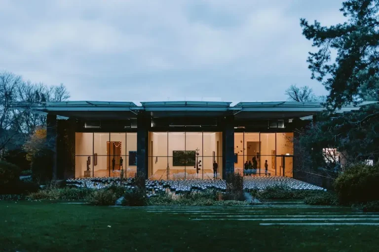 Modern building with large glass windows at dusk