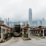 Buses are parked at a bus terminal in hong kong.