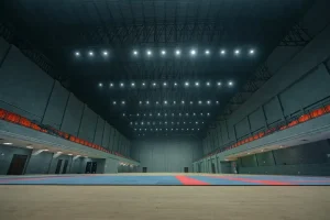 Empty indoor sports arena with spectator seating