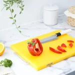 red bell pepper on yellow chopping board
