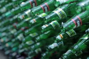 A collection of clean, sorted glass bottles ready for processing at a recycling center.
