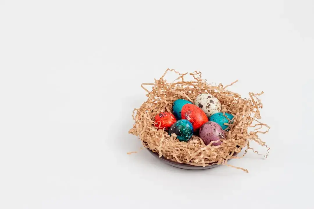 Handmade eco-friendly Easter decorations made from natural materials card and wooden eggs on a rustic background