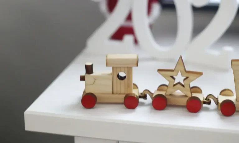 A variety of sustainable and ecological wooden toys and gifts for children arranged on a natural background.