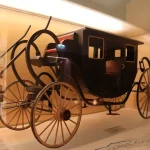 A vintage early electric vehicle from the 19th century representing the invention of the first electric car.