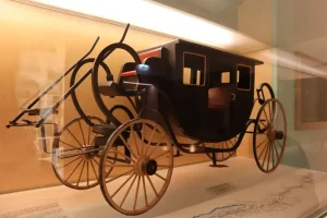 A vintage early electric vehicle from the 19th century representing the invention of the first electric car.