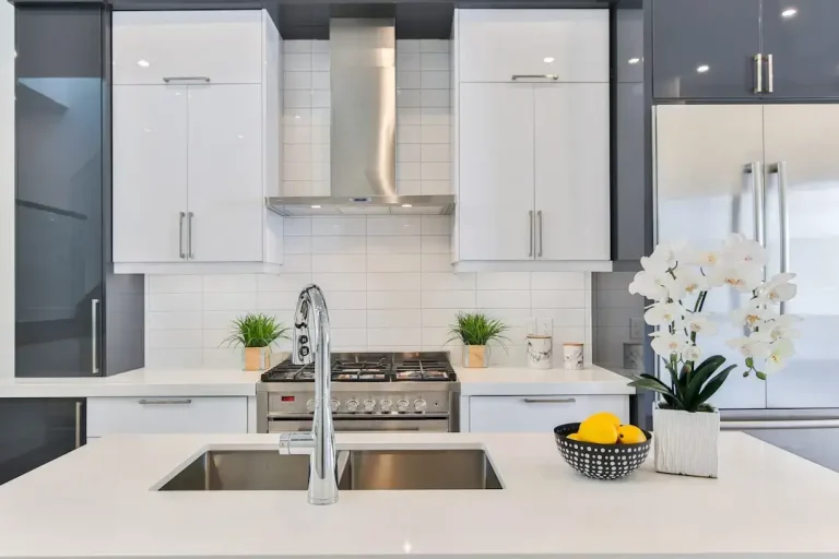 A sleek modern kitchen featuring energy-efficient appliances with high energy ratings.